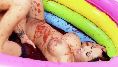 Romana Ryder & Tammia Lee in a pool full of strawberry jelly